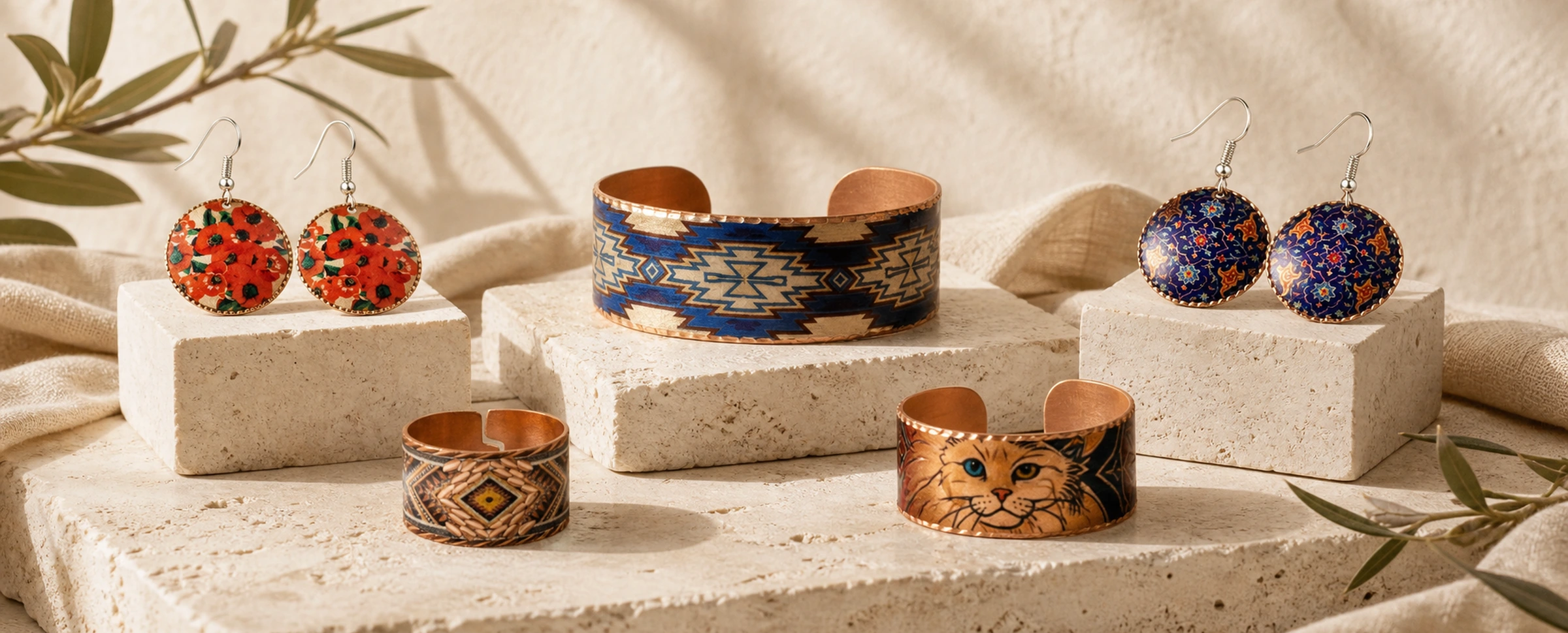 Colorful handmade copper jewelry collection with bracelets, earrings and rings